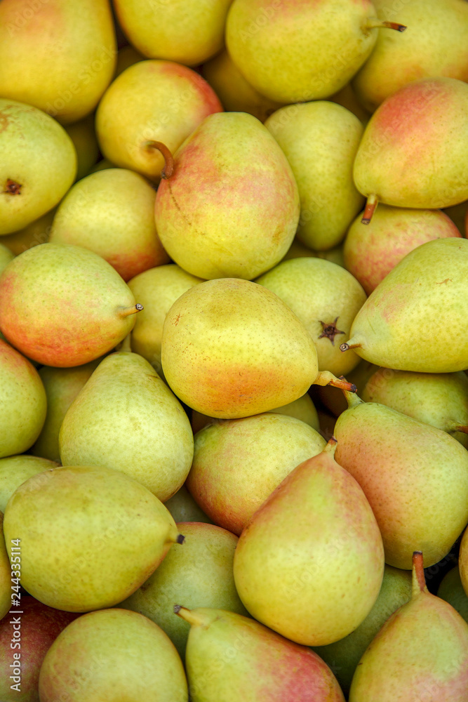 Fresh ripe pears as background, top view