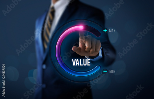 Growth value, increase value, value added or business growth concept. Businessman is pulling up circle progress bar with the word VALUE on dark tone background.