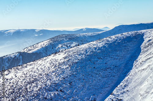 Winter snowy landscape at mountain during a sunny day with blue sky. The Mala Fatra national park in Slovakia  Europe.