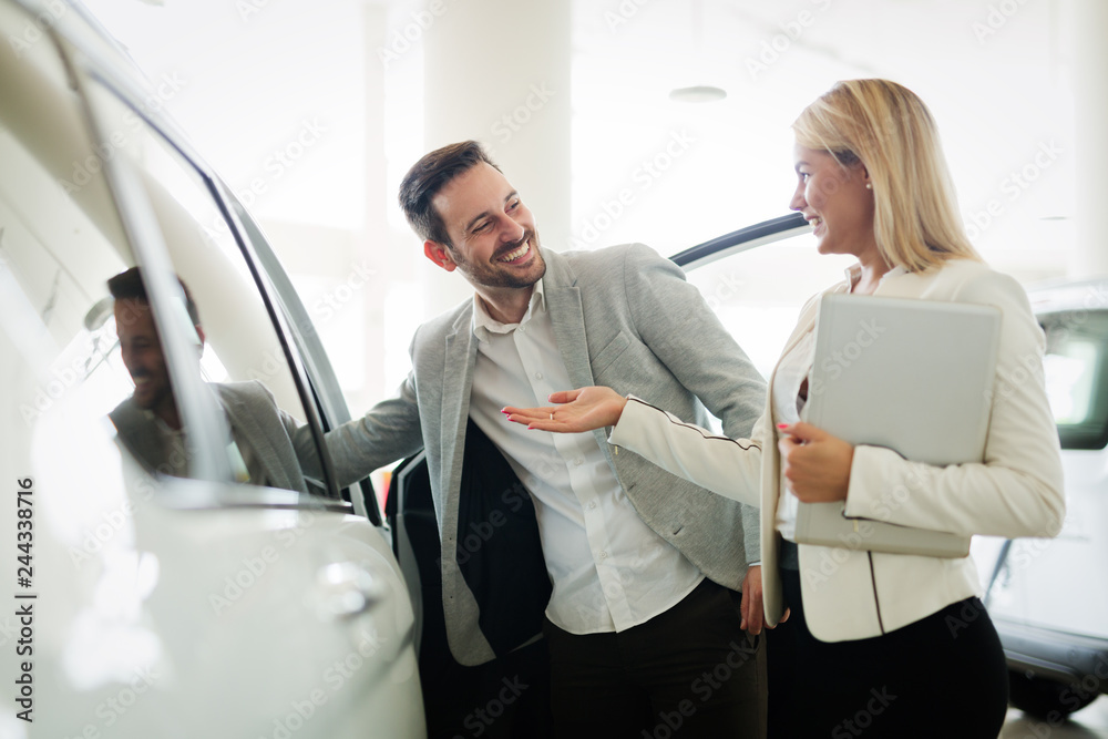 Portrait of happy customer buying new car Portrait of happy customer buying new car