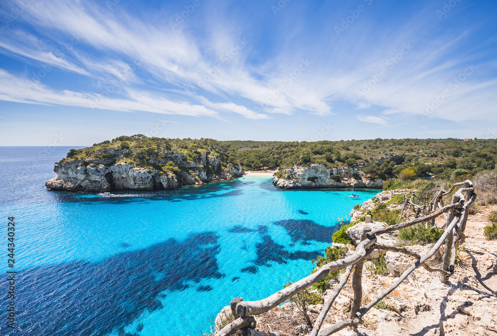 Beautiful bay with sandy beach and sailing boats, Menorca island, Spain