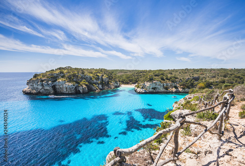Beautiful bay with sandy beach and sailing boats, Menorca island, Spain photo