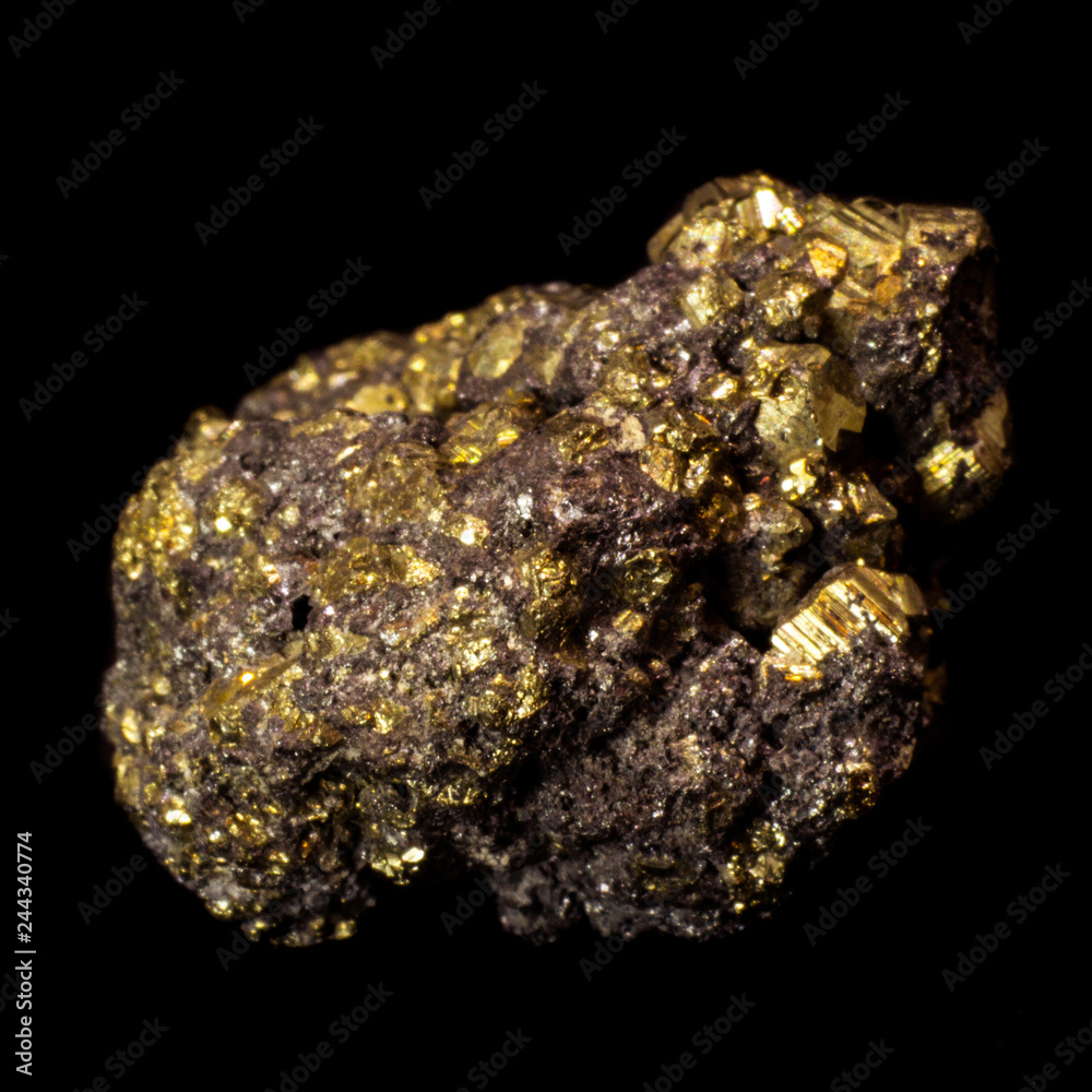 Small natural druse of pyrite on a black background Small natural druse of pyrite on a black background