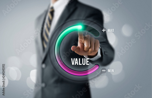 Growth value, increase value, value added or business growth concept. Businessman is pulling up circle progress bar with the word VALUE on bright tone background.