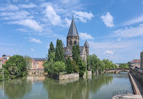 Temple Neuf (New Temple), a Protestant city church in Metz, France. View from a bridge across the Moselle river. The church was built in 1901-1904 by design of the German architect Conrad Wahn.