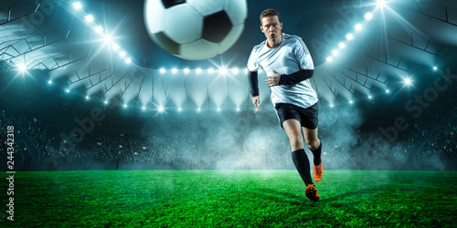 Football player runs in the stadium © Michael Stifter