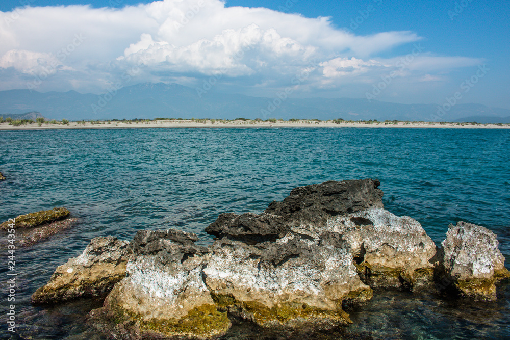 Mediterranean landscape. View from rocky island in the sea Mediterranean landscape. View from rocky island in the sea