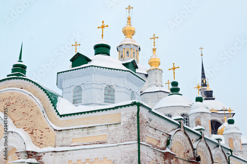 Golden domes of orthodox church in winter against the blue sky background, Veliky Ustyug, Russia