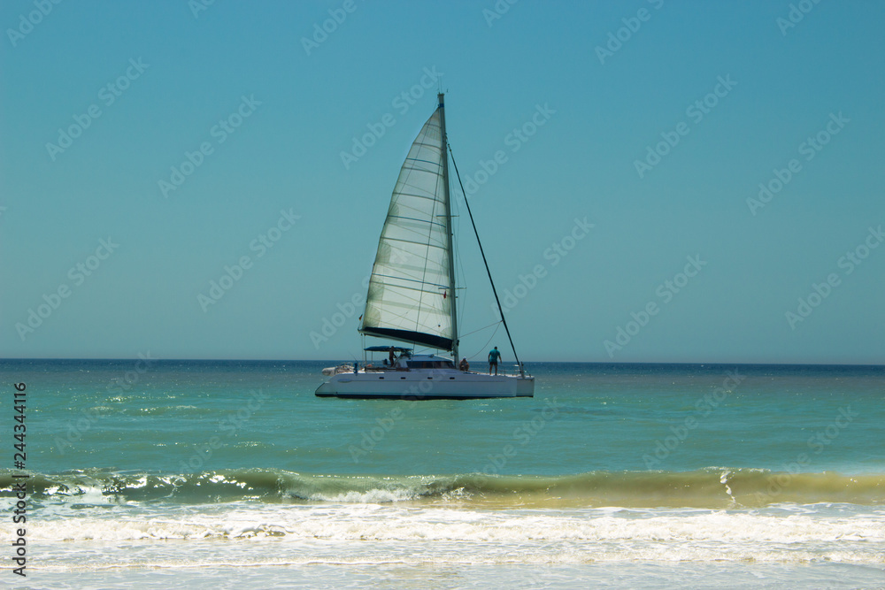 Obraz premium Sailing boat in the Mediterranean sea. 20 km long sandy beach of Patara. Turkey