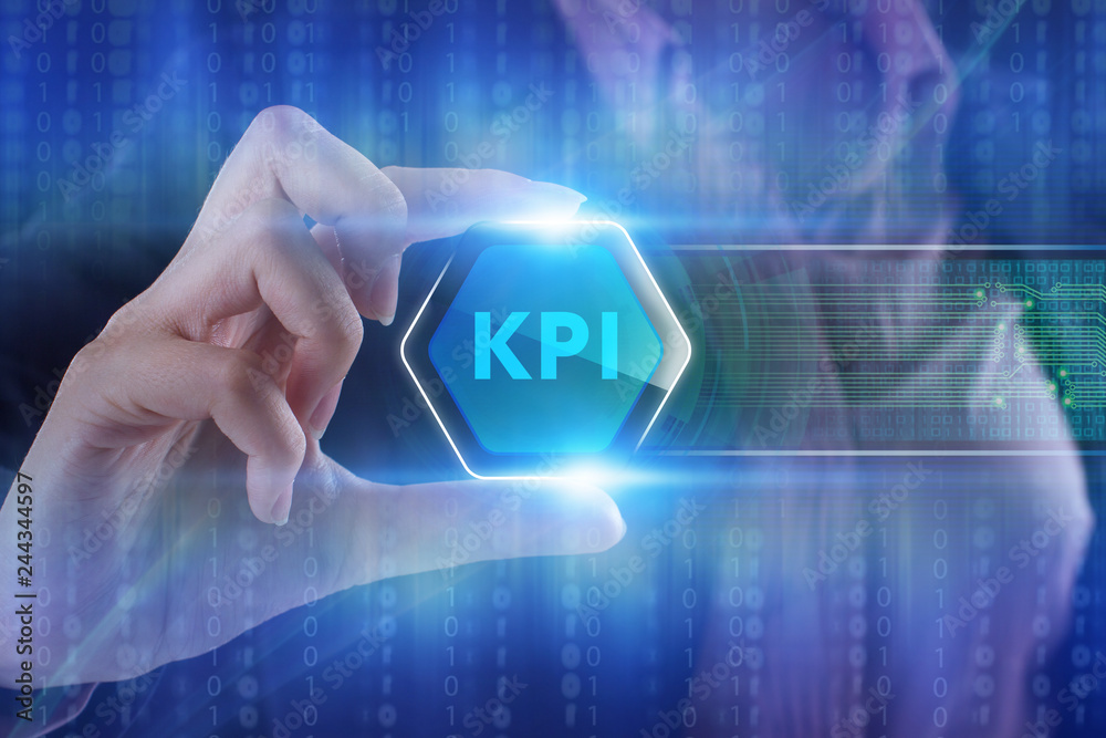 The concept of business, technology, the Internet and the network. A young entrepreneur working on a virtual screen of the future and sees the inscription: KPI The concept of business, technology, the Internet and the network. A young entrepreneur working on a virtual screen of the future and sees the inscription: KPI