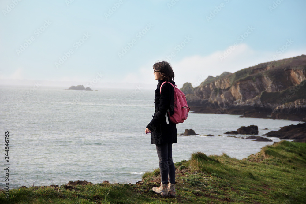 woman traveling alone in the french Brittany in winter season and having good time