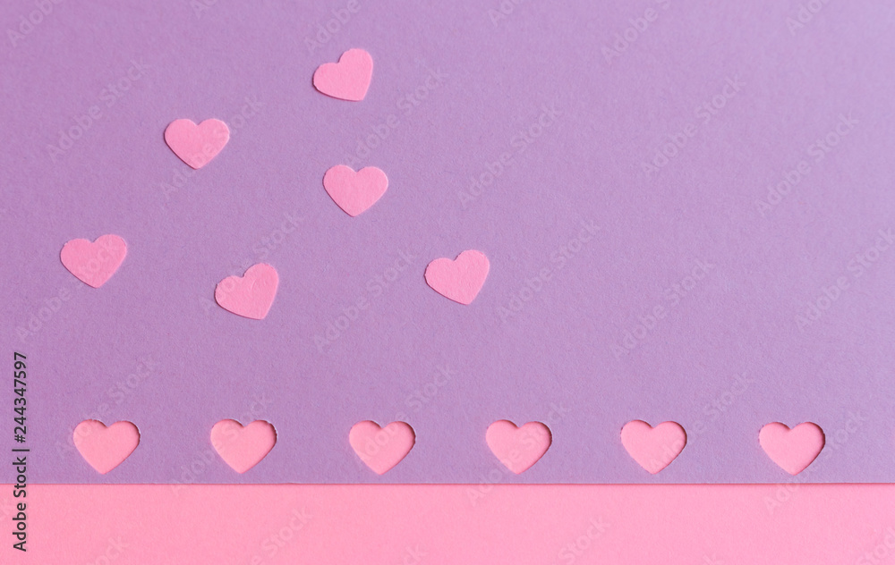 Little paper heart confetti on pink lilac purple background, copyspace. St.Valentine's Day. Love concept card. Minimalism