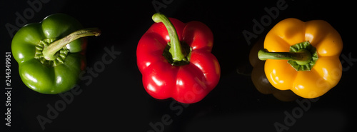 Vegetables on black background, pepper, paprika