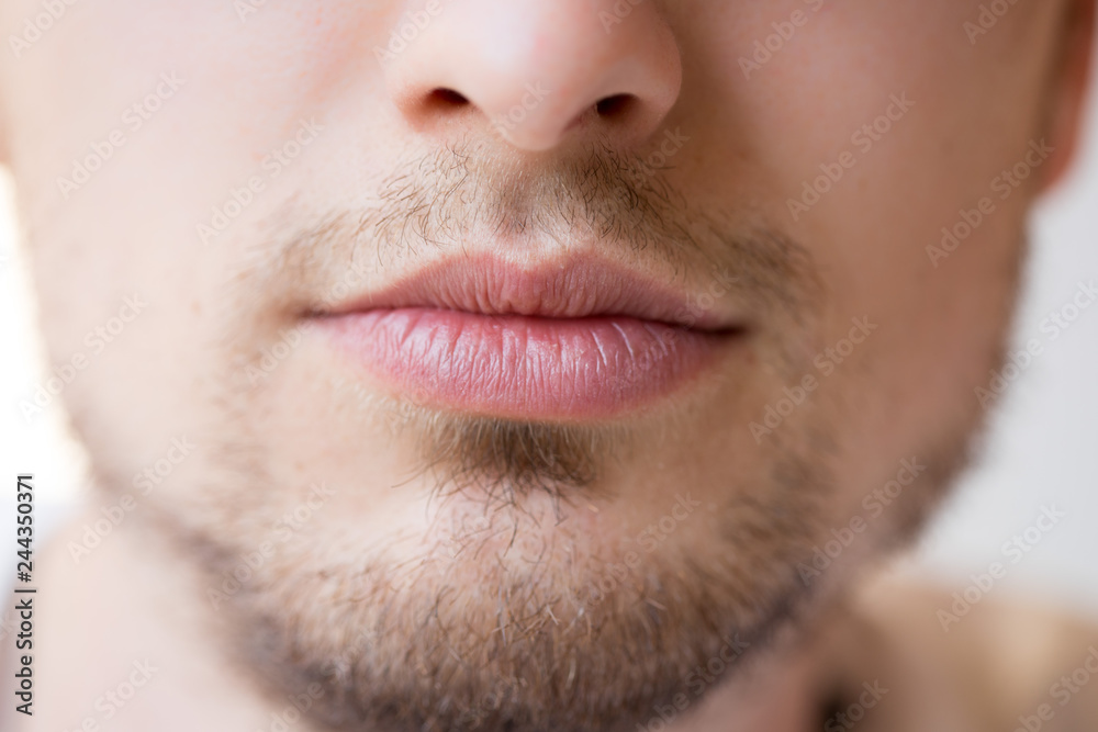 Fototapeta premium Young man with red lips and beard