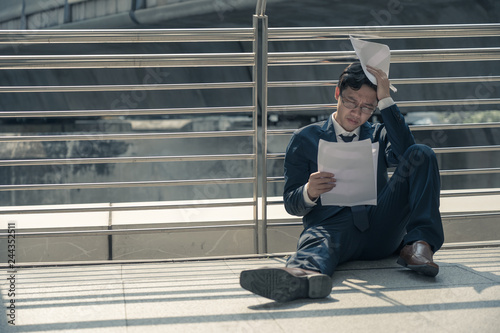 Portraits of Asian businessman stressed from work.anxiety in adult cause to depression and a problem in living that drag you down to feeling sadness,lonely and worried.
