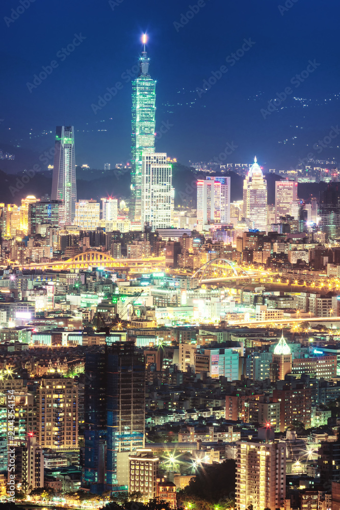 Night view of Downtown Taipei city, capital city of Taiwan, with view of prominent Taipei 101 tower amid skyscrapers in Xinyi Financial District