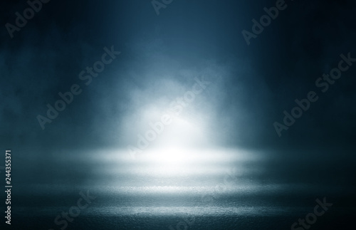 Black background of empty street, room, blue searchlight illuminates asphalt, smoke © Laura Сrazy