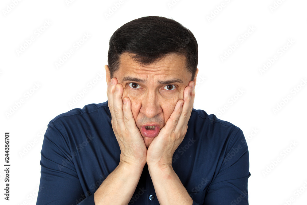 Portrait of a frustrated man on a white background. Concept emotion disappointment Portrait of a frustrated man on a white background. Concept emotion disappointment