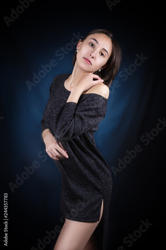 Studio portrait of a girl on a dark background