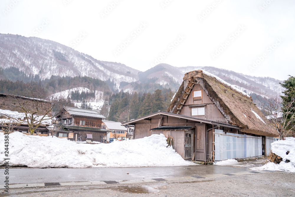 Villages of Shirakawago and Gokayama are one of Japan's UNESCO World Heritage Sites. Farm house in the village and mountain behind.