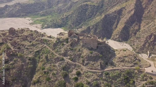 Cinematic lateral 4k drone aerial footage of the ghost town of Amendolea, Calabria, Italy