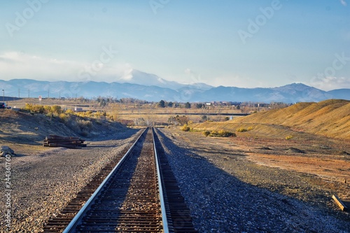 Train tracks around the Cradleboard Trail walking path on the Carolyn Holmberg Preserve in Broomfield with views of hiking trails, by Denver Colorado, Rocky Mountains, United States. photo