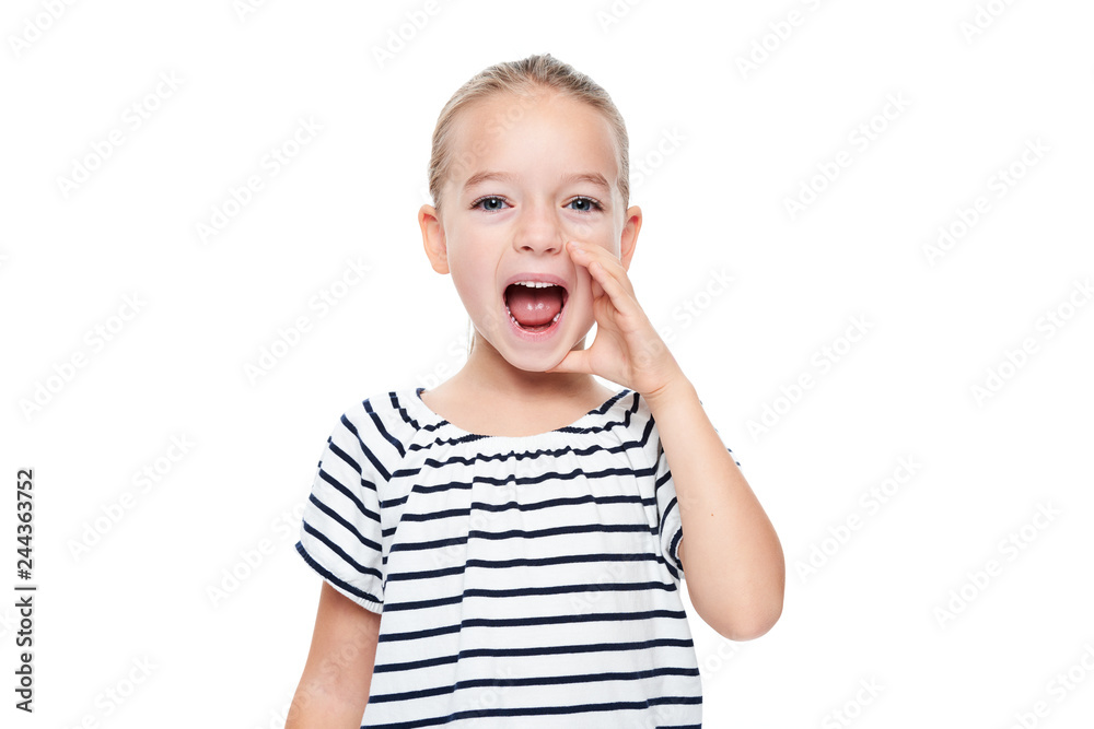 Cute little girl in stripped T-shirt shouting. Speech therapy concept over white background. - obrazy, fototapety, plakaty 