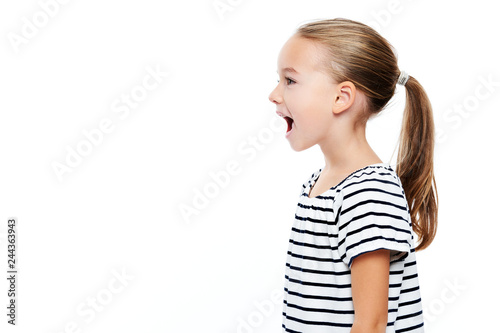 Fotografi Cute little girl in stripped T-shirt talking