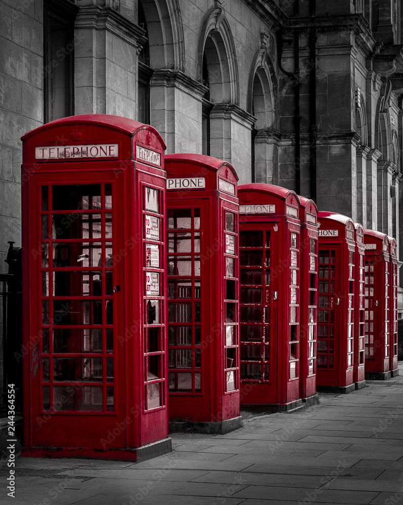 Red old English Phone boxes in a black and white setting Red old English Phone boxes in a black and white setting