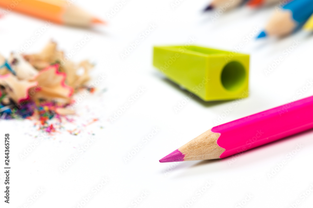 colored pencils and shavings with pencils. Sharpener of pencils on a white background. colored pencils and shavings with pencils. Sharpener of pencils on a white background.