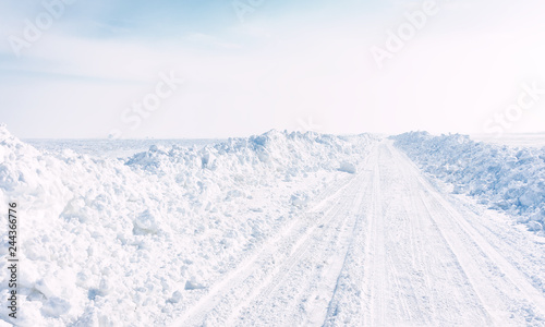 winter landscape with road and blue sky