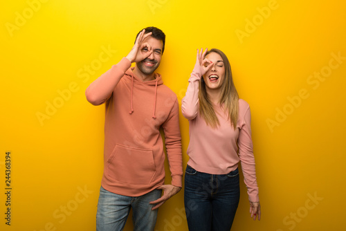 Canvas Print Group of two people on yellow background makes funny and crazy face emotion