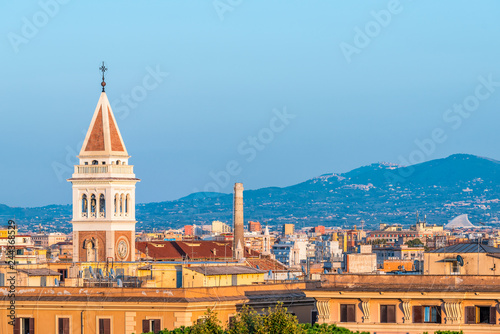 Historic Italian town of Rome, Italy cityscape skyline with high angle view of colorful architecture old buildings tower at sunset evening night photo