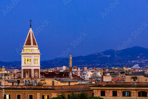 Historic Italian town of Rome, Italy cityscape skyline with high angle view of blue and purple sky with architecture old buildings tower in dark night