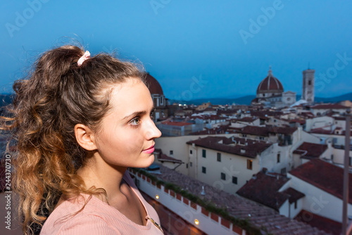 Firenze, Florence, Italy historic city with church duomo famous dome architecture in summer evening sunset night cityscape skyline and young woman girl rooftops © Kristina Blokhin