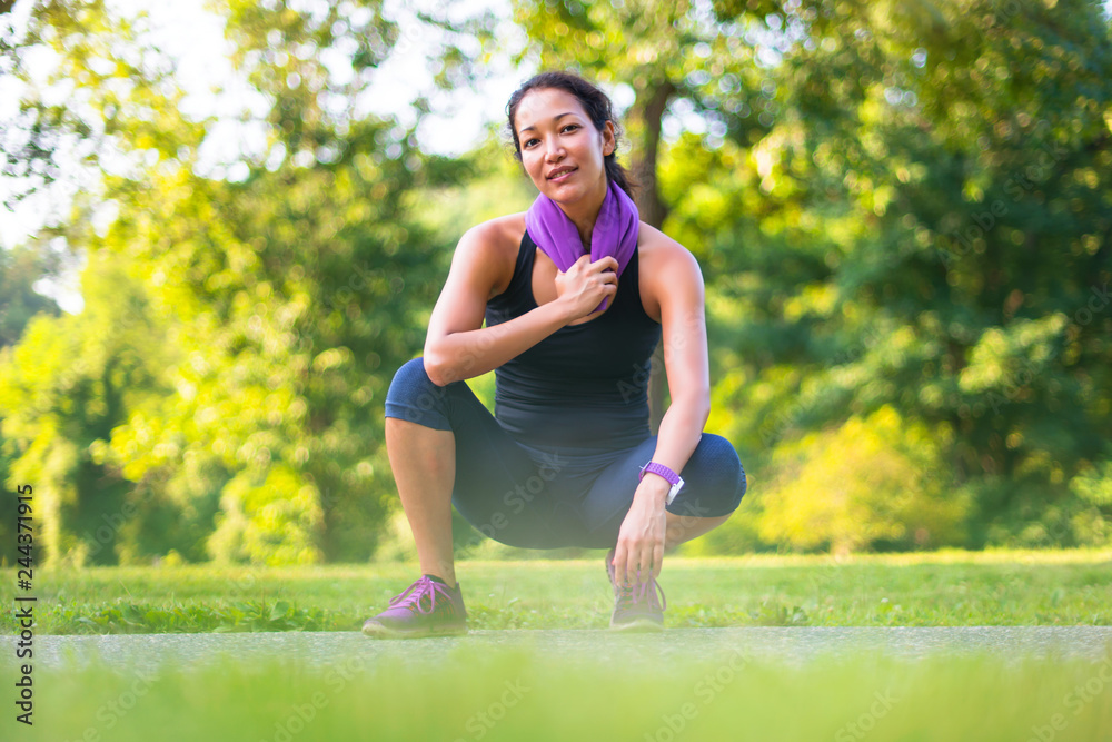 Sport asian woman with towel at the park Sport asian woman with towel at the park