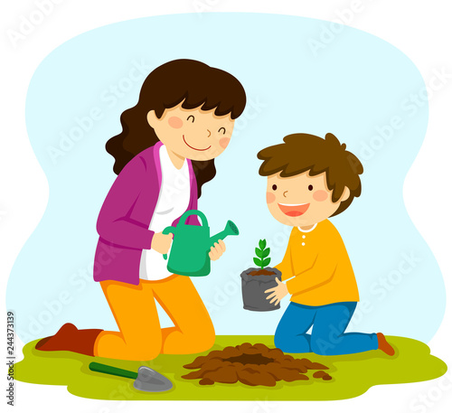 Woman and child planting a sapling