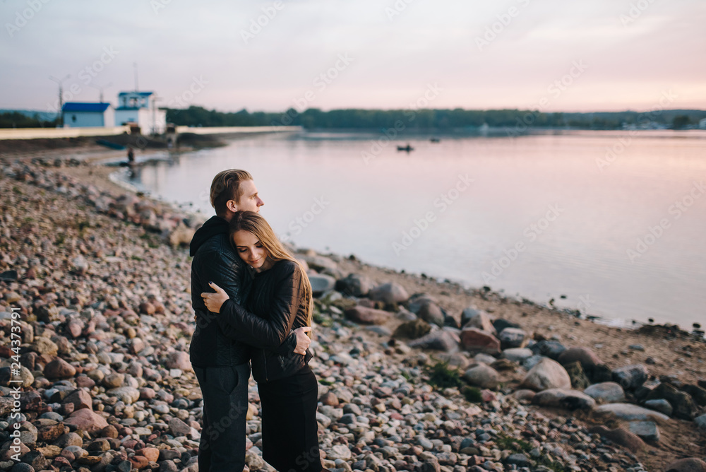 Love is in the air. Beautiful young couple embracing and smiling outdoors Love is in the air. Beautiful young couple embracing and smiling outdoors