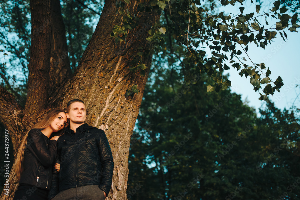 Love is in the air. Beautiful young couple embracing and smiling outdoors Love is in the air. Beautiful young couple embracing and smiling outdoors