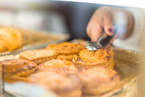 Person taking a salty piece of meat to sell it in a bakery