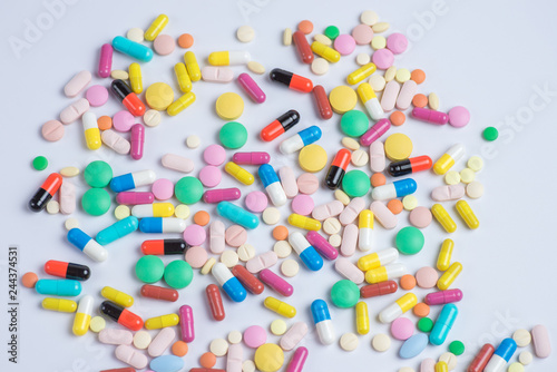 Tablets and pills on a white background