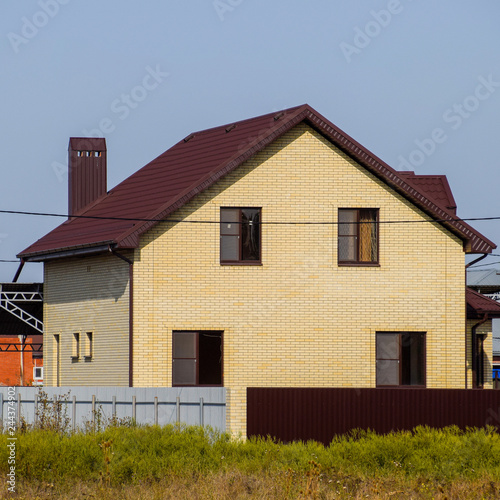 The house with plastic windows and a roof of corrugated sheet © eleonimages