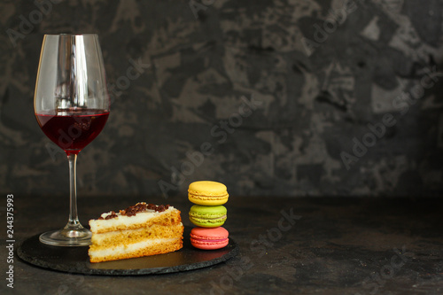 red wine, cake and macaroons, dessert (sweets). food background. top photo