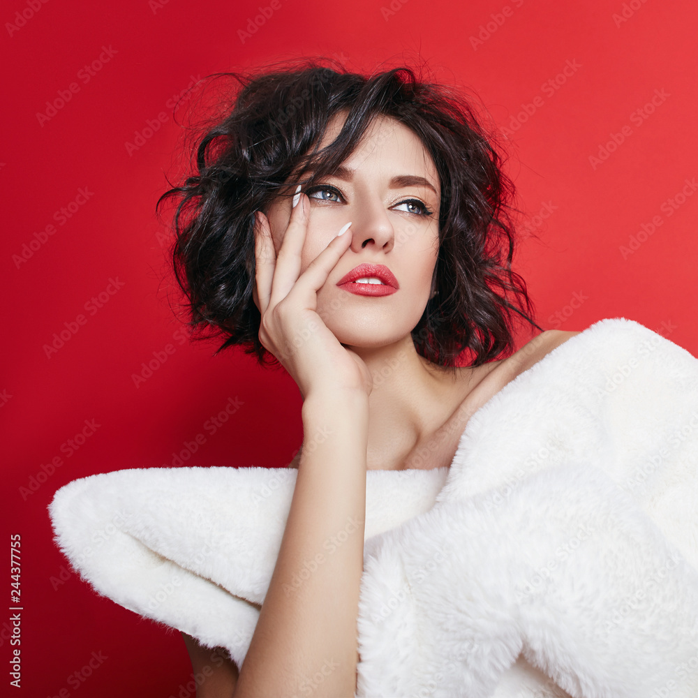 Naked sexy woman with short hair. Girl posing in a white jacket on a red  background. Perfect clean skin, sexy Nude body of brunette woman. Skin  rejuvenation and hydration Stock Photo