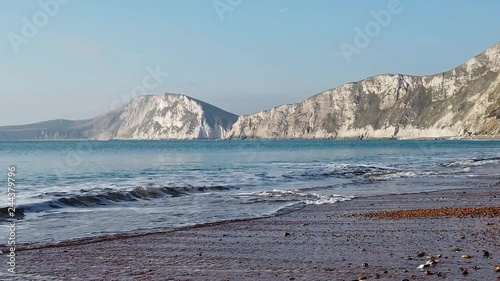 120fps slow-mo with oan of waves on the beach on the Jurassic Coast in Dorset, UK. photo