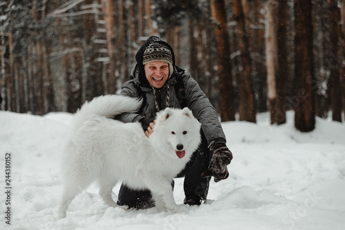 people playing with funny dog in winter forest © Vadym