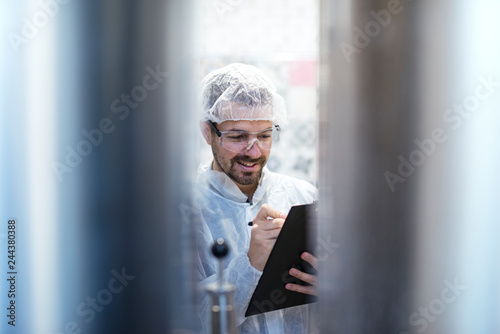 Tableau sur toile Technologist expert controlling productivity in industrial production line