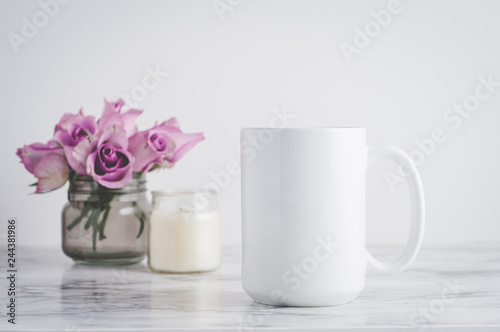 blank white mug with roses and a candle