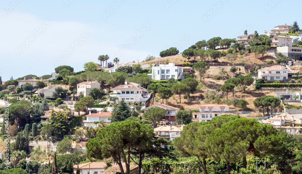 Village of white houses in the Sierra de Malaga, in Spain, on a sunny day.