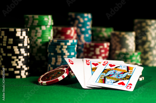 Gambling concept - Cards on chips background